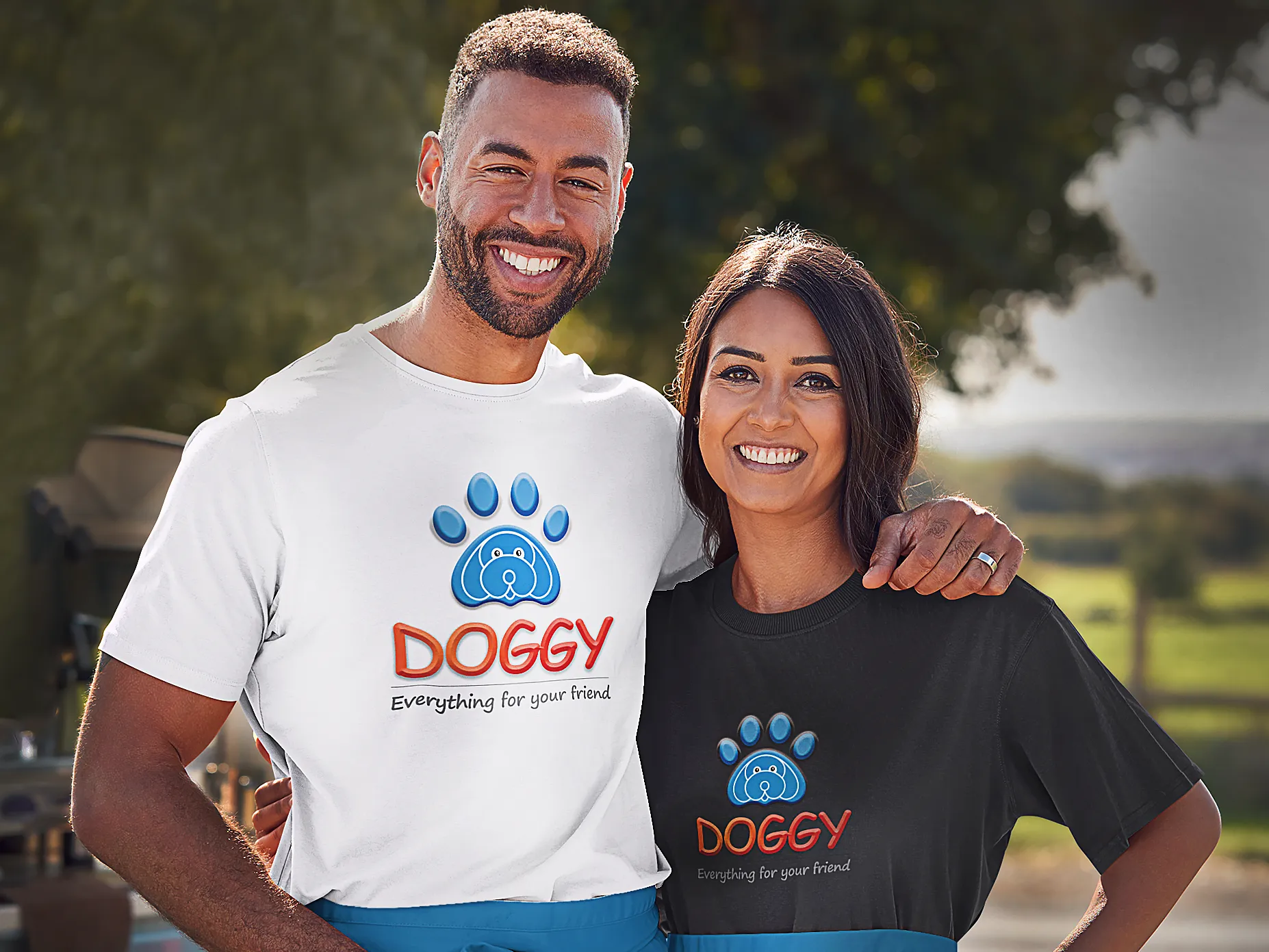 Couple wearing t-shirt with doggy logo in the center in which the man is wearing a white one whereas the woman is wearing a black one.